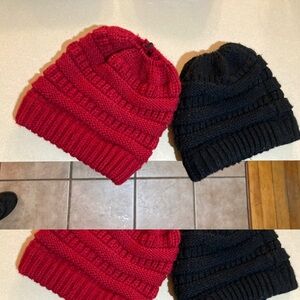 Two knit warm winter ponytail hats, one red one black